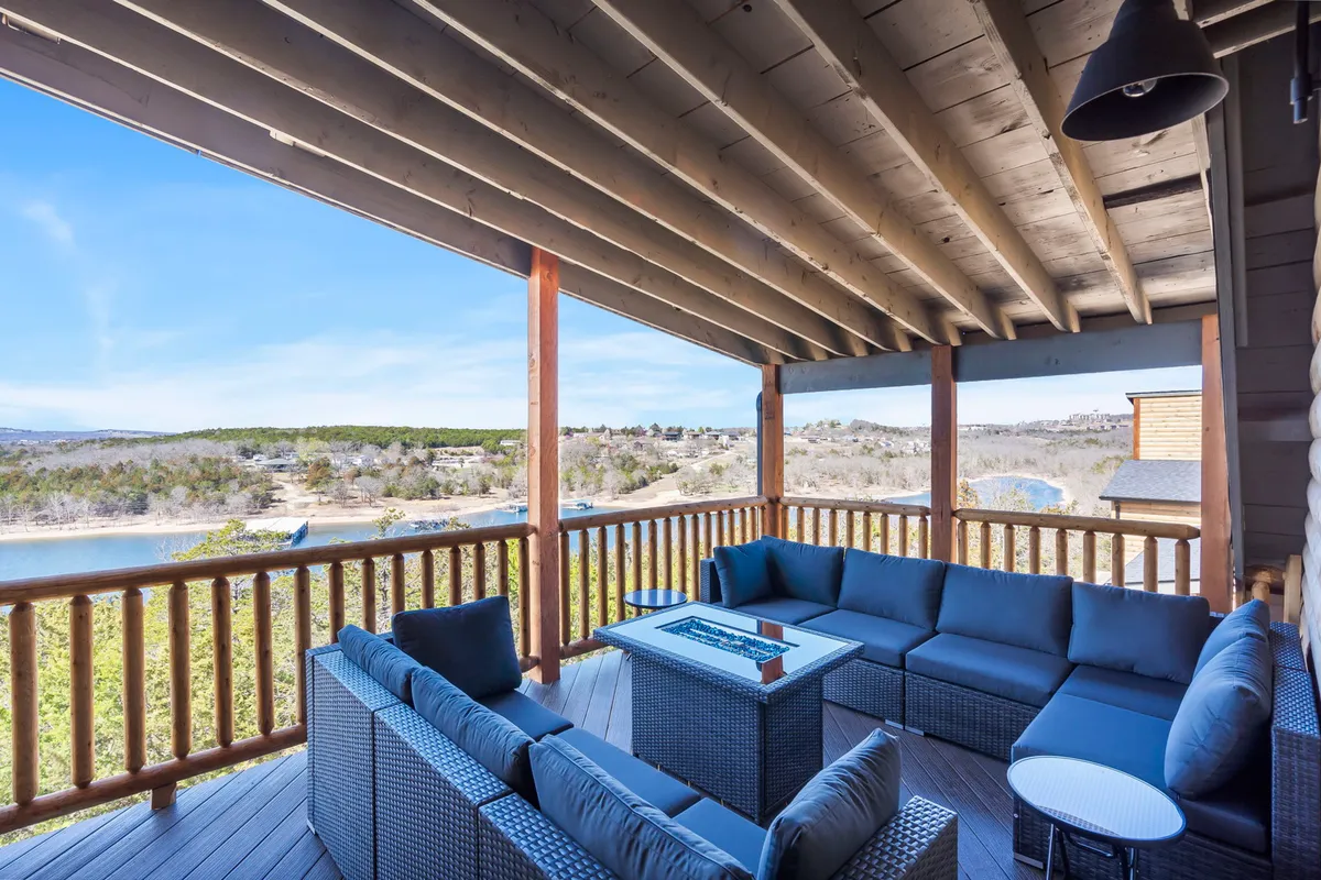 This image showcases an inviting outdoor seating area with a fire pit and a stunning scenic view in the background. The arrangement suggests a perfect spot for group relaxation, morning coffee, or winding down together in the evening while enjoying the natural surroundings.